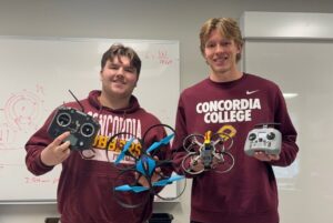 Photo of Concordia College teaching assistants with a Blue Heron drone (on the left) and SpeedyBee B35 quadcopter kit used in 2025-2026 (on the right).